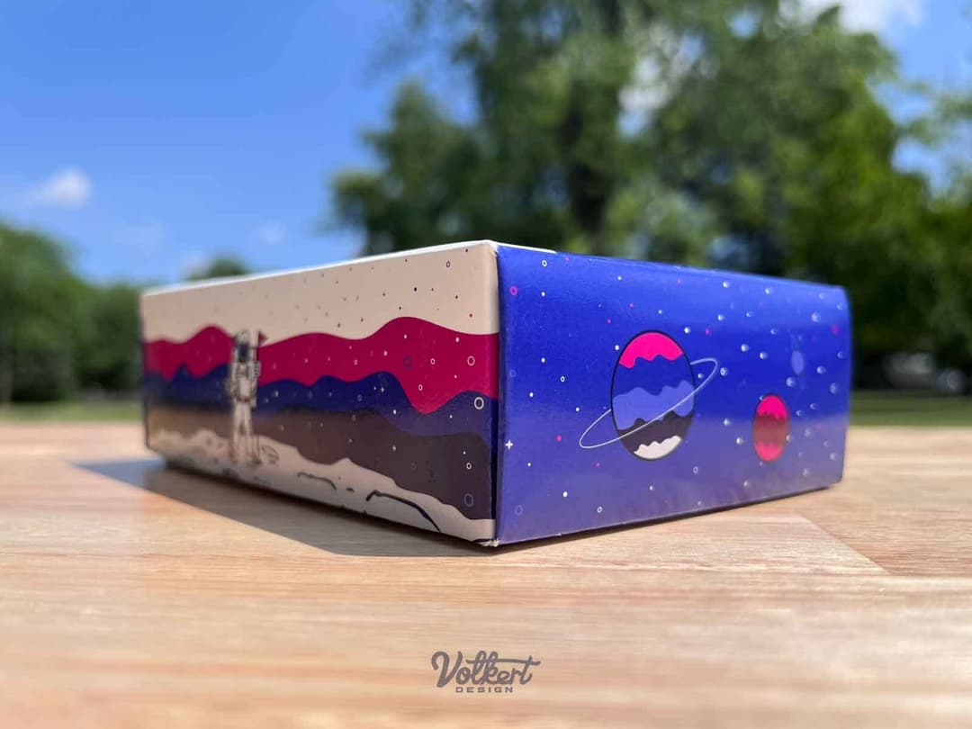 Alien planets on the shorter side and the golfer astronaut on the longer edge.