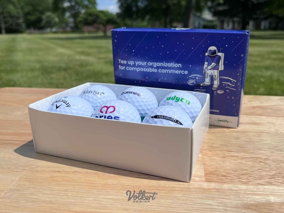 A picture of six promotional golf balls, heck yeah!