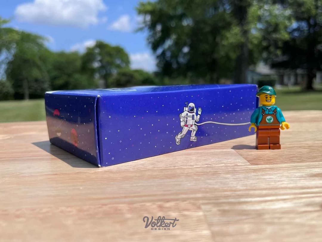 Minifigure for scale next to a promotional box of golf balls, in case you were curious