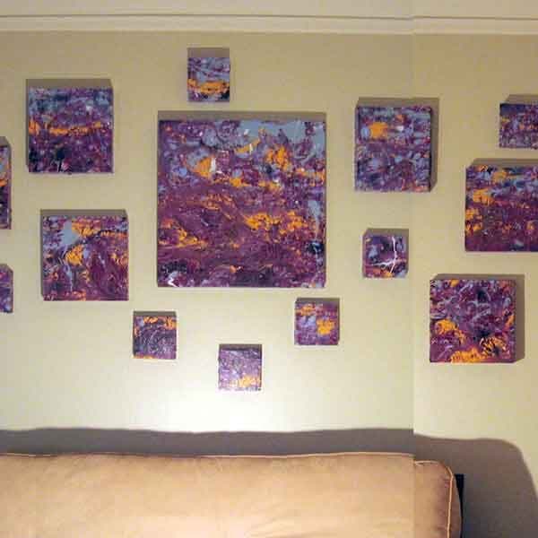 A series of various sized panels represented as one piece with a dark purple color and hints of orange, blue and white.