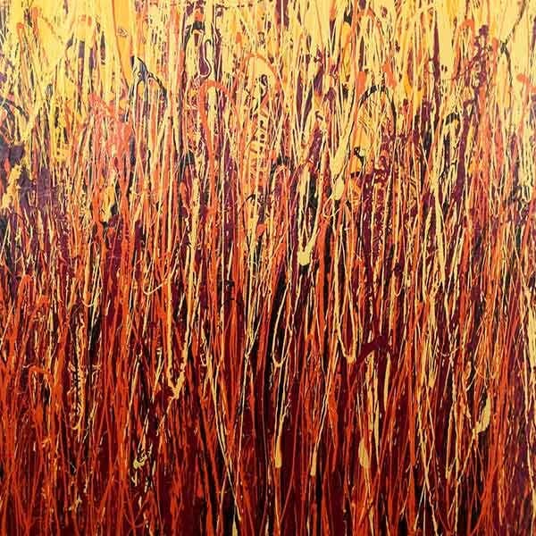 A vertical abstract piece on canvas with deep reds, red, orange and yellows that feel very fall-like.