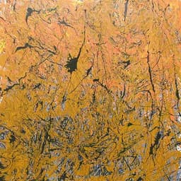 Scattered hairline lines and splatters of black cover a golden field of color with hints of orange and blue.