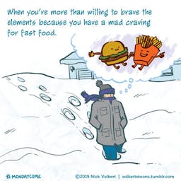 A man braves the elements for fast food.
