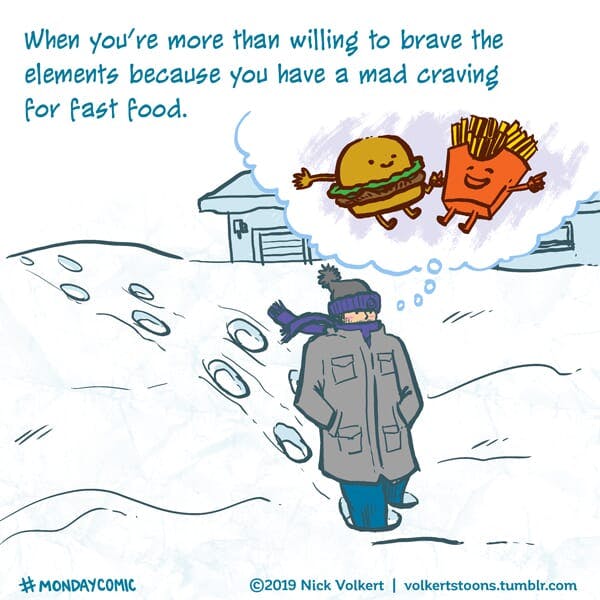 A man braves the elements for fast food.