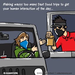 A man in a mask happily gets food and human interaction in a fast food drive thru.