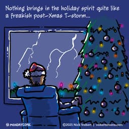 A young man watches a storm from beside his fully lit Christmas tree.
