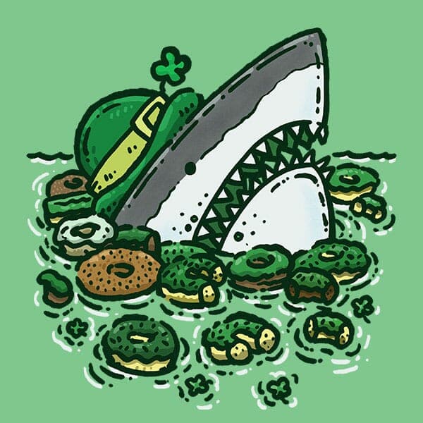 A shark all dressed up for St Patricks Day pops out of the water surrounded by a gaggle of St Patricks Day themed donuts!